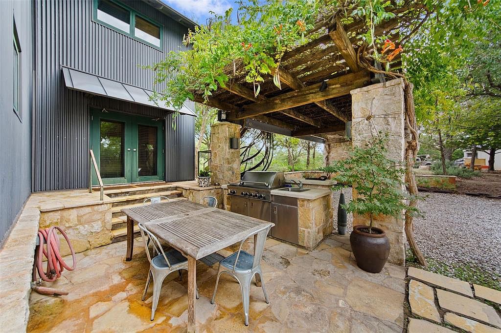 Ranch House, ENR architects with Frank D. Welch Associates, Montague County, TX 76255 - Patio BBQ - N Mud Entry